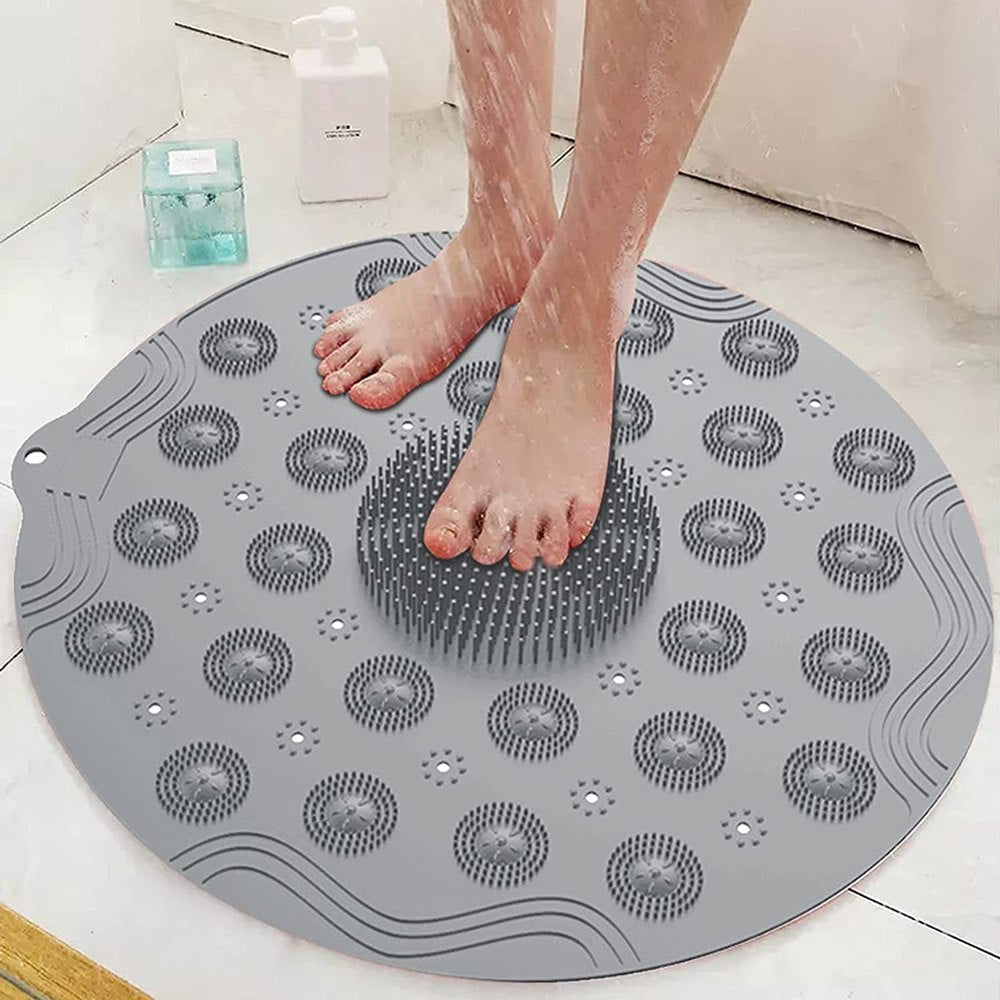 Person stepping onto a textured gray mat in a bathroom setting