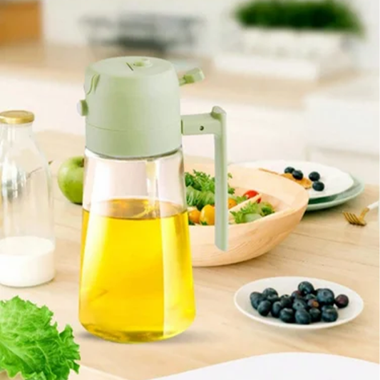 Oil dispenser on a kitchen counter with salad and berries